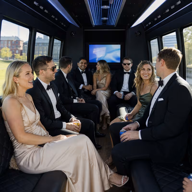 Wedding guests seated inside a Indianapolis party bus