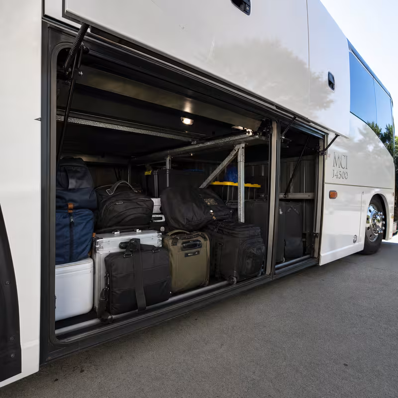 Party bus interior with wraparound leather seating and LED lighting in Indianapolis