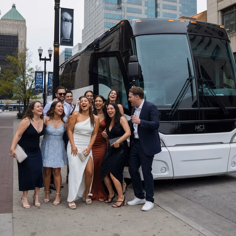 Passengers loading luggage while boarding an Indianapolis group shuttle