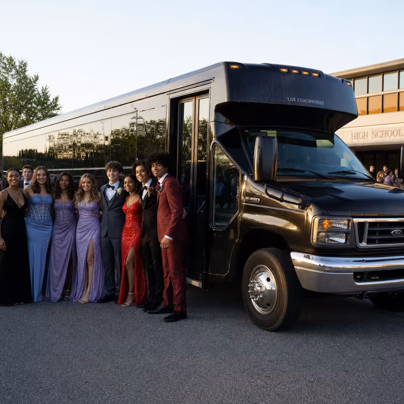 Group boarding a white charter bus for Prom & Homecoming Transportation transportation in Indianapolis
