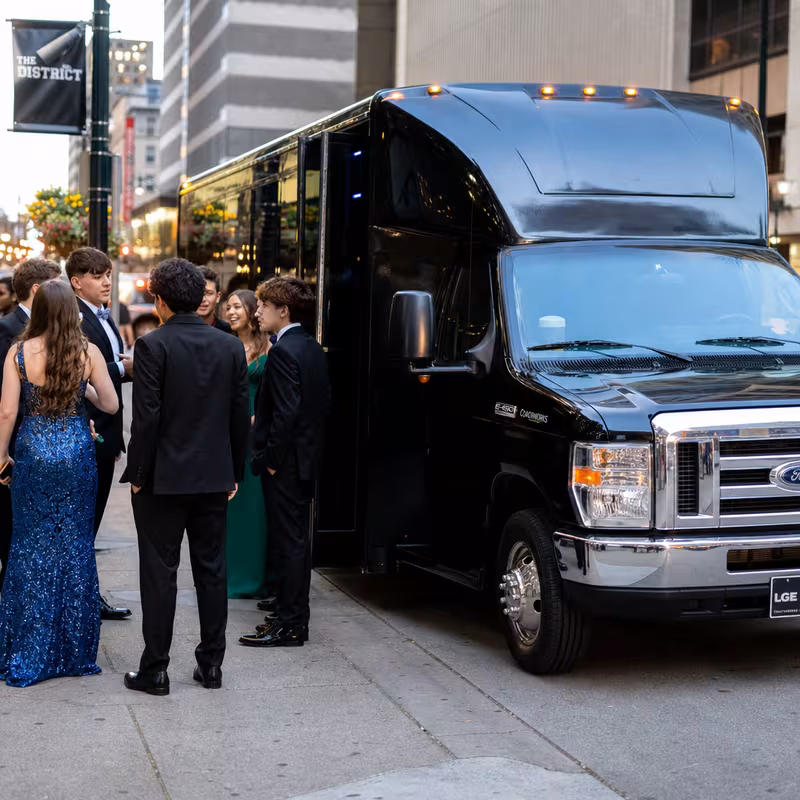 Passengers loading luggage while boarding an Indianapolis group shuttle