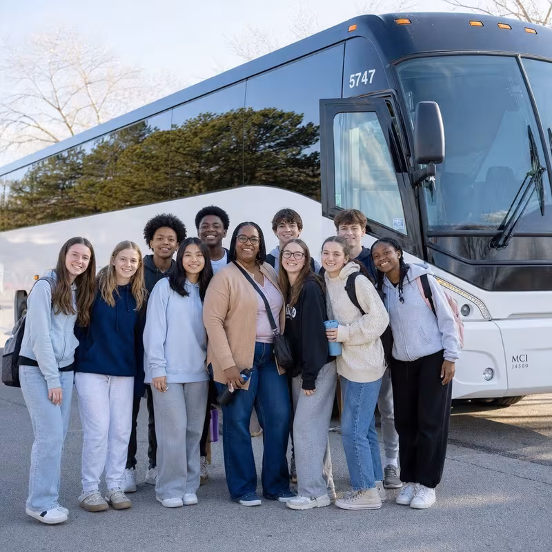 Passengers loading luggage while boarding an Indianapolis group shuttle