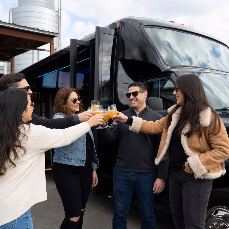 Passengers loading luggage while boarding an Indianapolis group shuttle